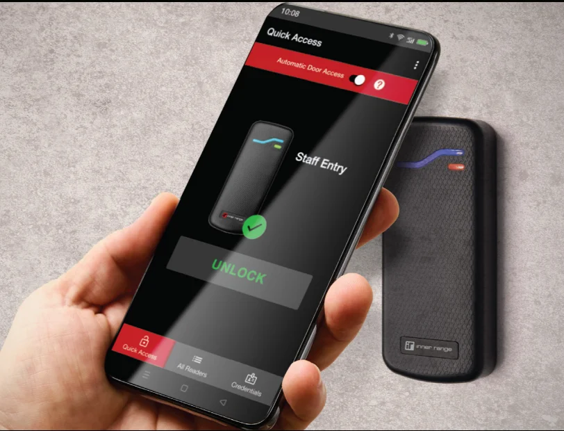 Employee using smartphone access credential to unlock a commercial door reader